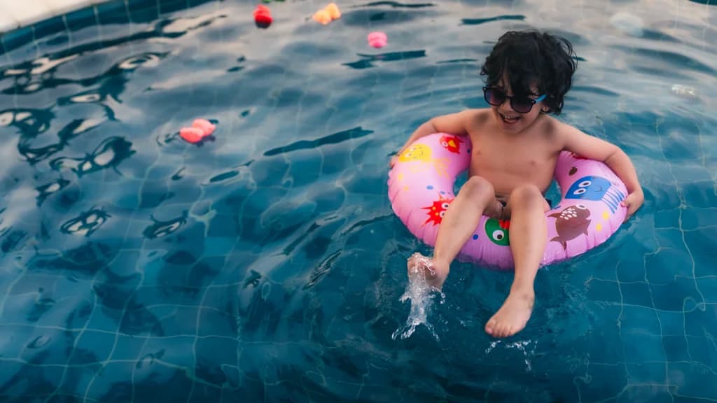 Kid enjoying the swimming pool